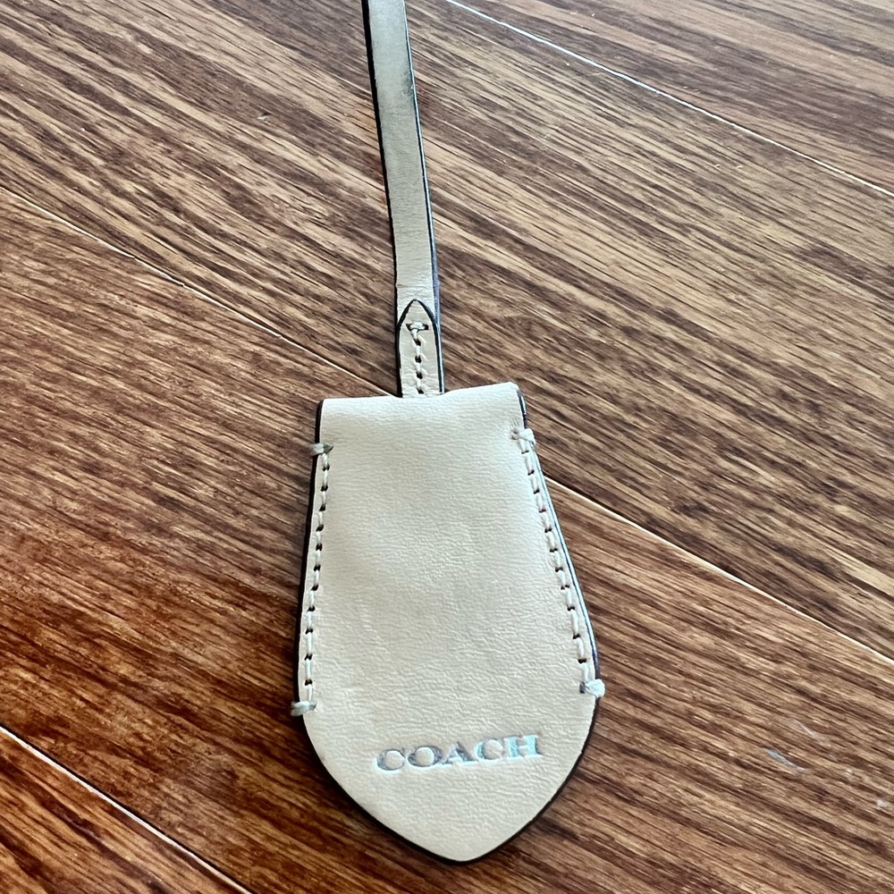 Coach cream leather purse hang tag
